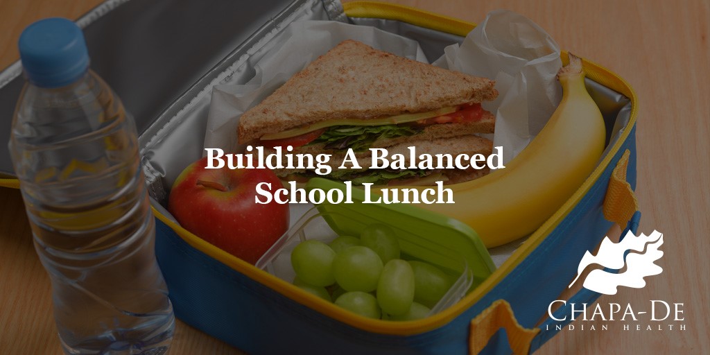 Header "Building a balanced school lunch" over a packed lunch image